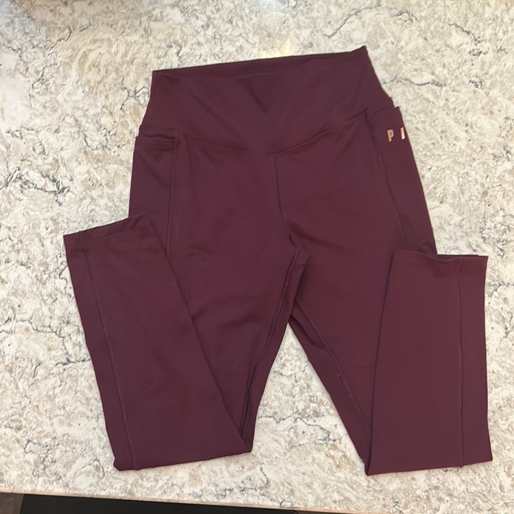 PINK  maroon leggings with pockets size medium.